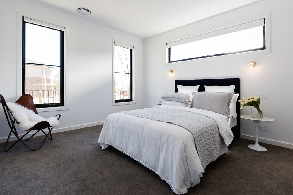 Should You Place A Bed Or Couch In Front Of A Window? black windows look dated Peak Windows Logan, UT
